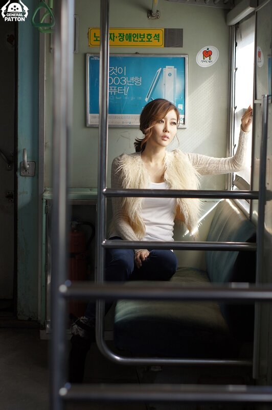 Woman Sitting on Train — White