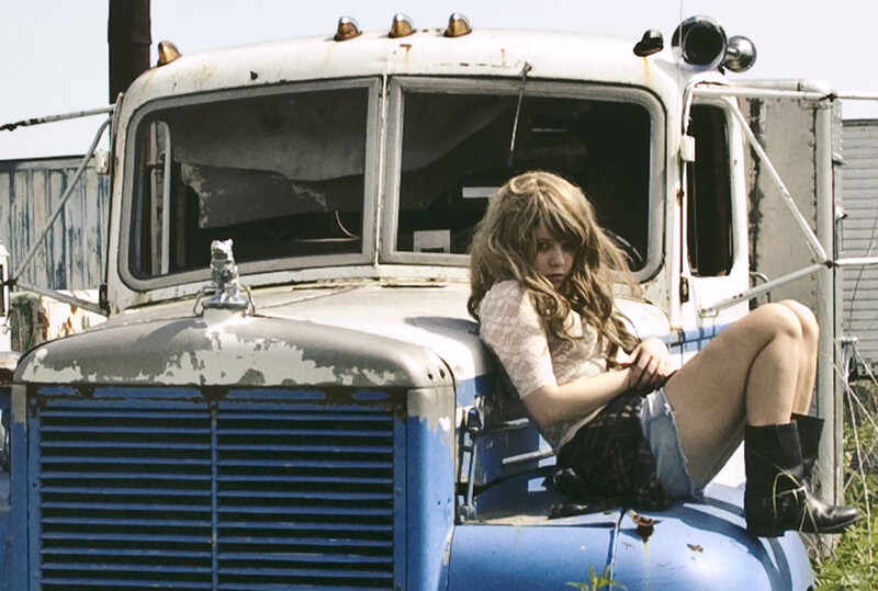 Woman Sitting on Truck — Blue