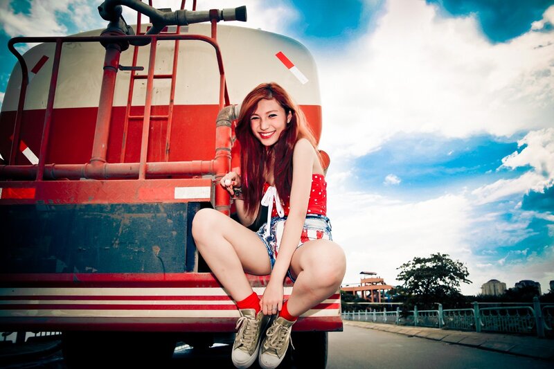 Woman sitting on truck