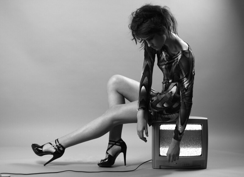 Woman Sitting on TV