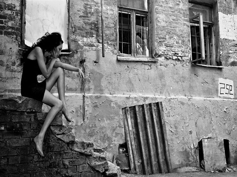 Woman Sitting on Wall — Black, Dramatic