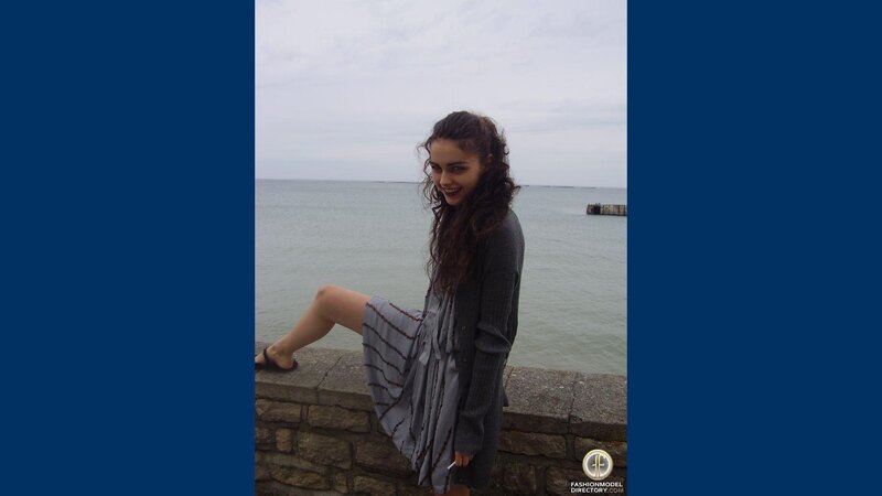 Woman Sitting on Wall — Blue, Calm