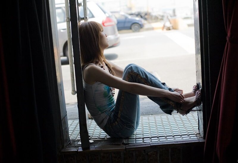 Woman Sitting on Window Sill — Blue