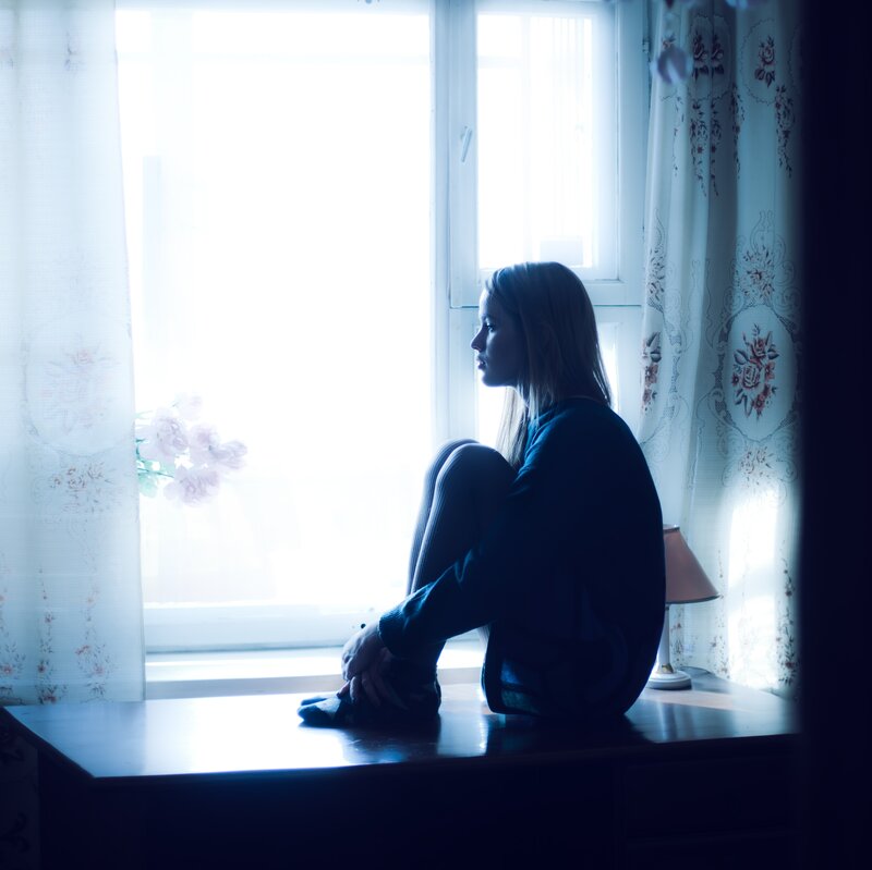 Woman Sitting on Windowsill — Blue, Melancholic