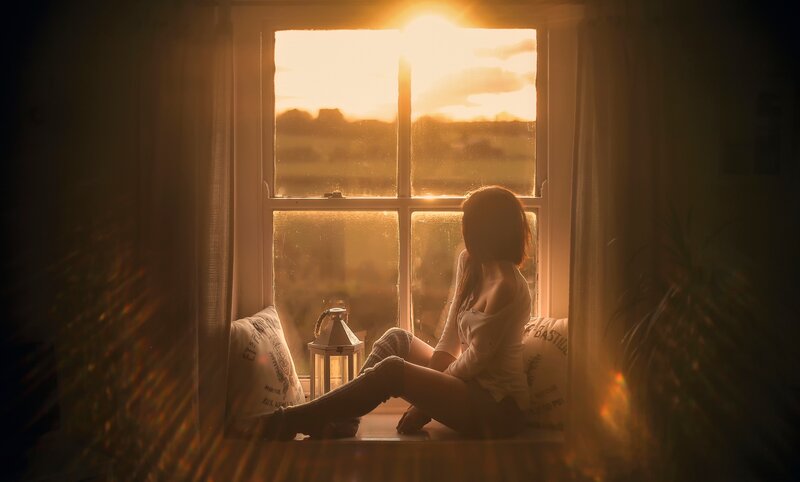Woman Sitting on Windowsill — Golden