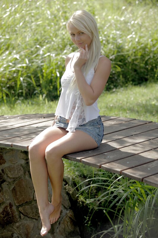 Woman sitting on wooden bench