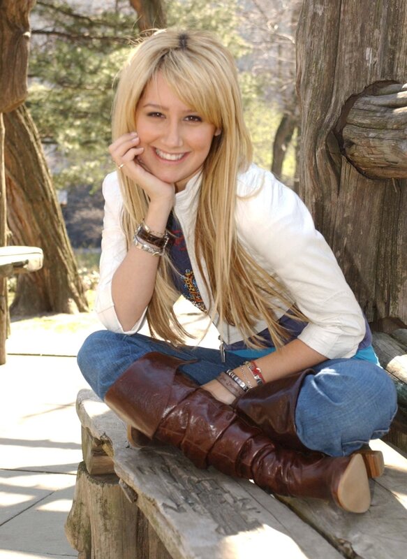 woman sitting on wooden bench