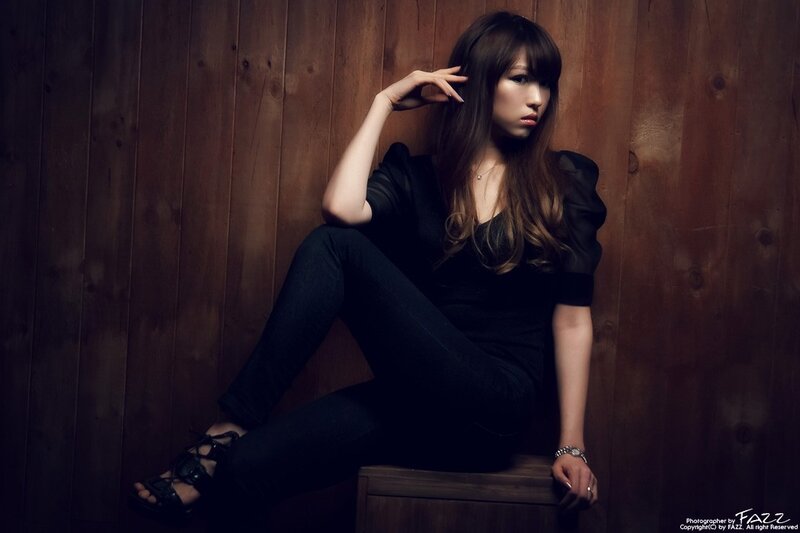 woman sitting on wooden box