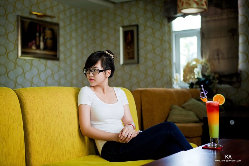 woman sitting on yellow couch