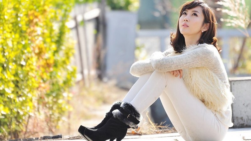 woman sitting outdoors in winter