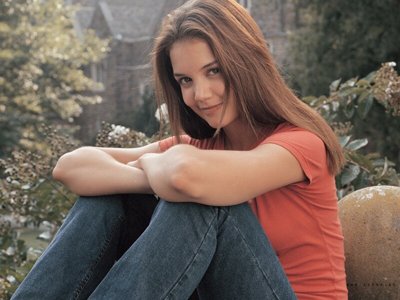 woman sitting outdoors smiling