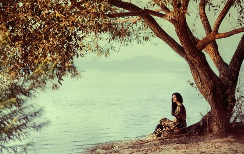 Woman Sitting under Tree — Brown, Serene