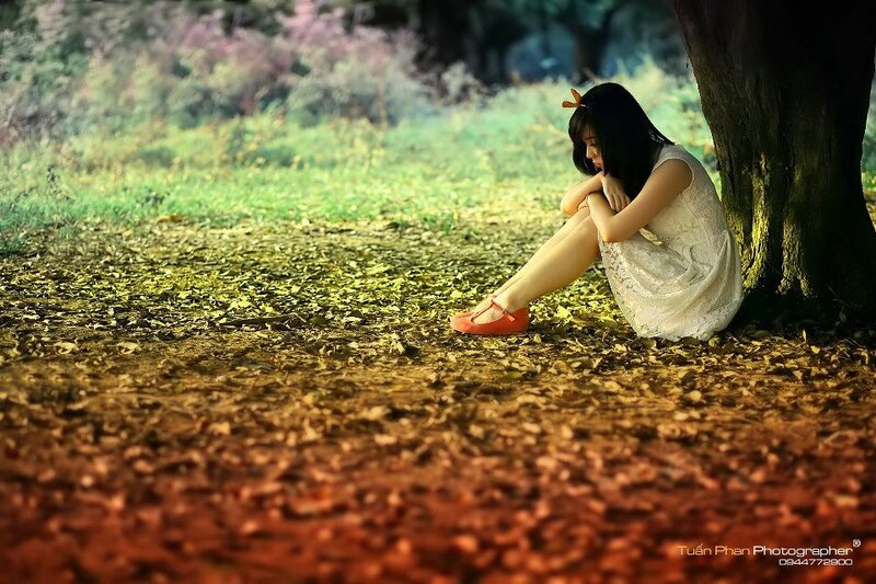 Woman Sitting under Tree — Green, Melancholic