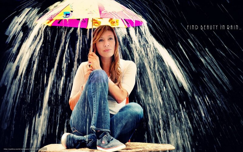 Woman Sitting under Umbrella