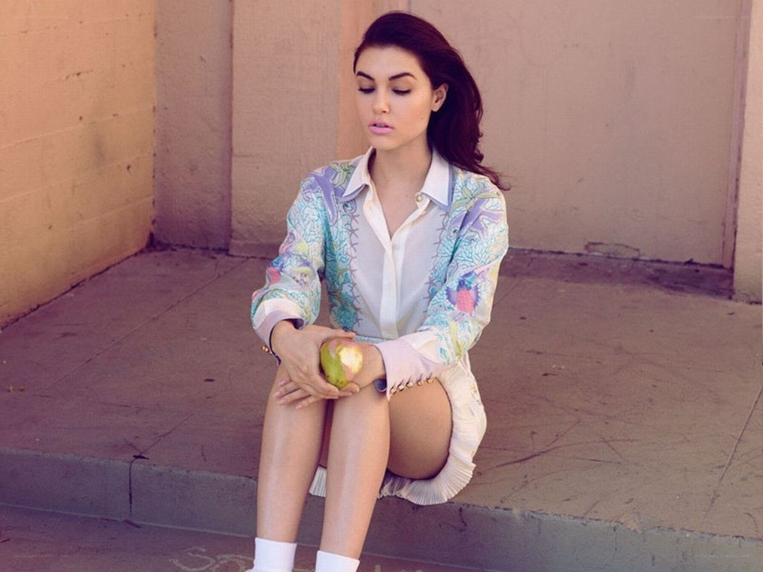woman sitting with apple