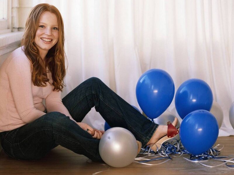 Woman Sitting with Balloons