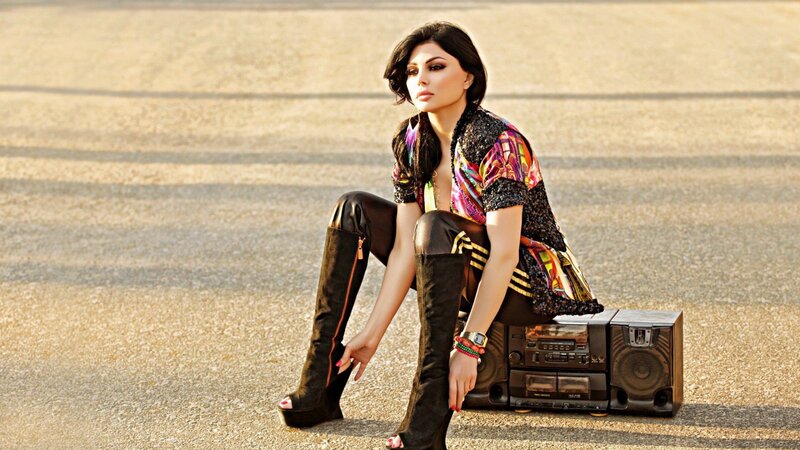 woman sitting with boombox