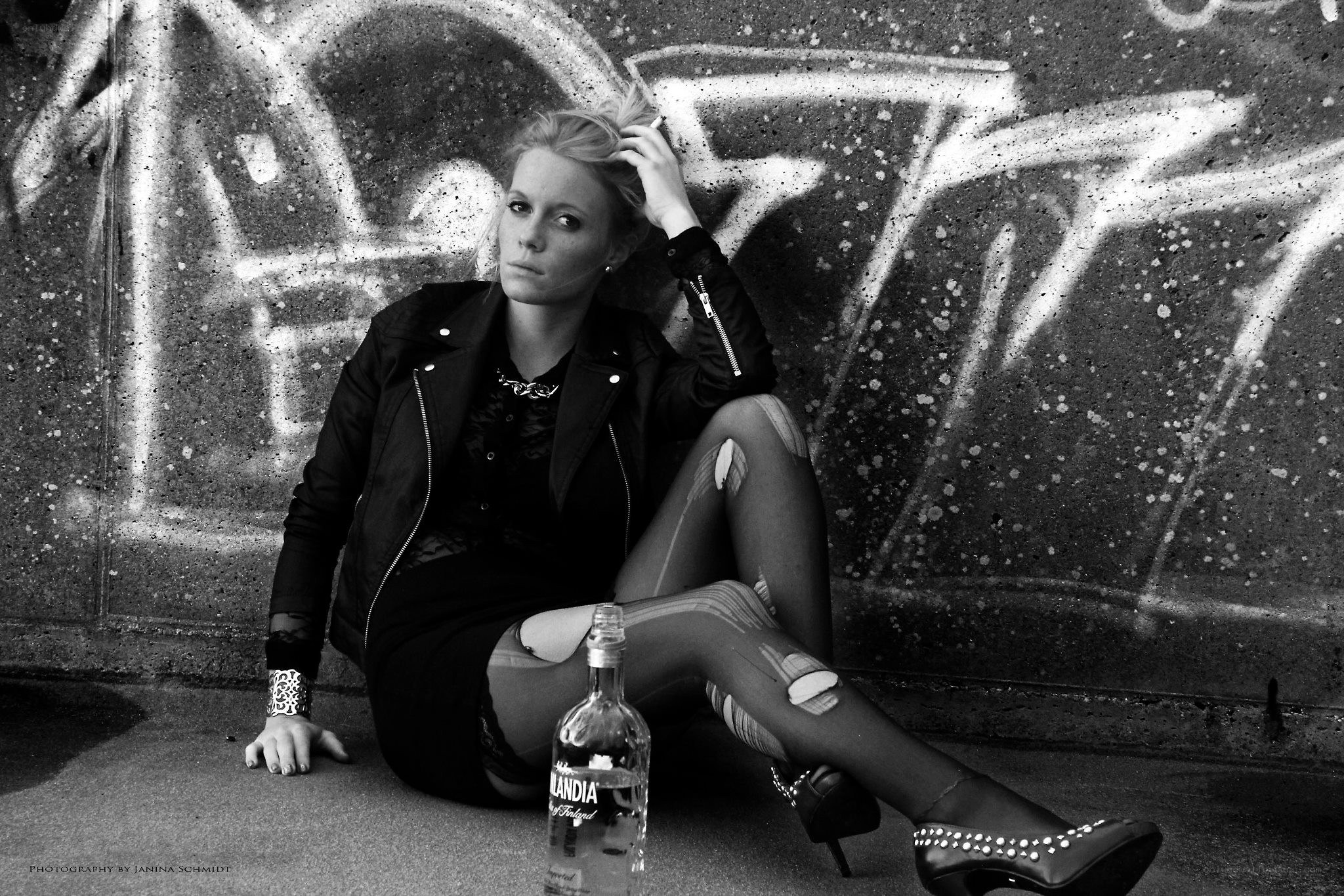 woman sitting with bottle