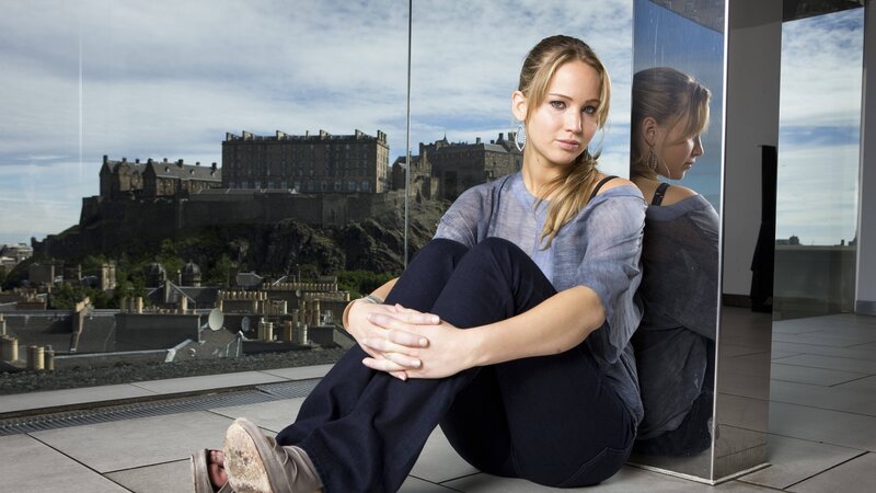 woman sitting with castle view