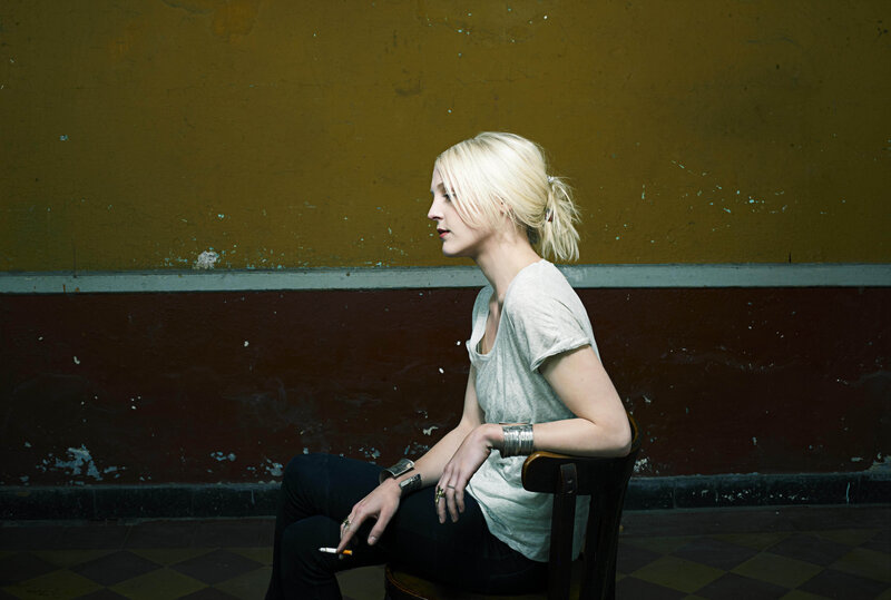 woman sitting with cigarette