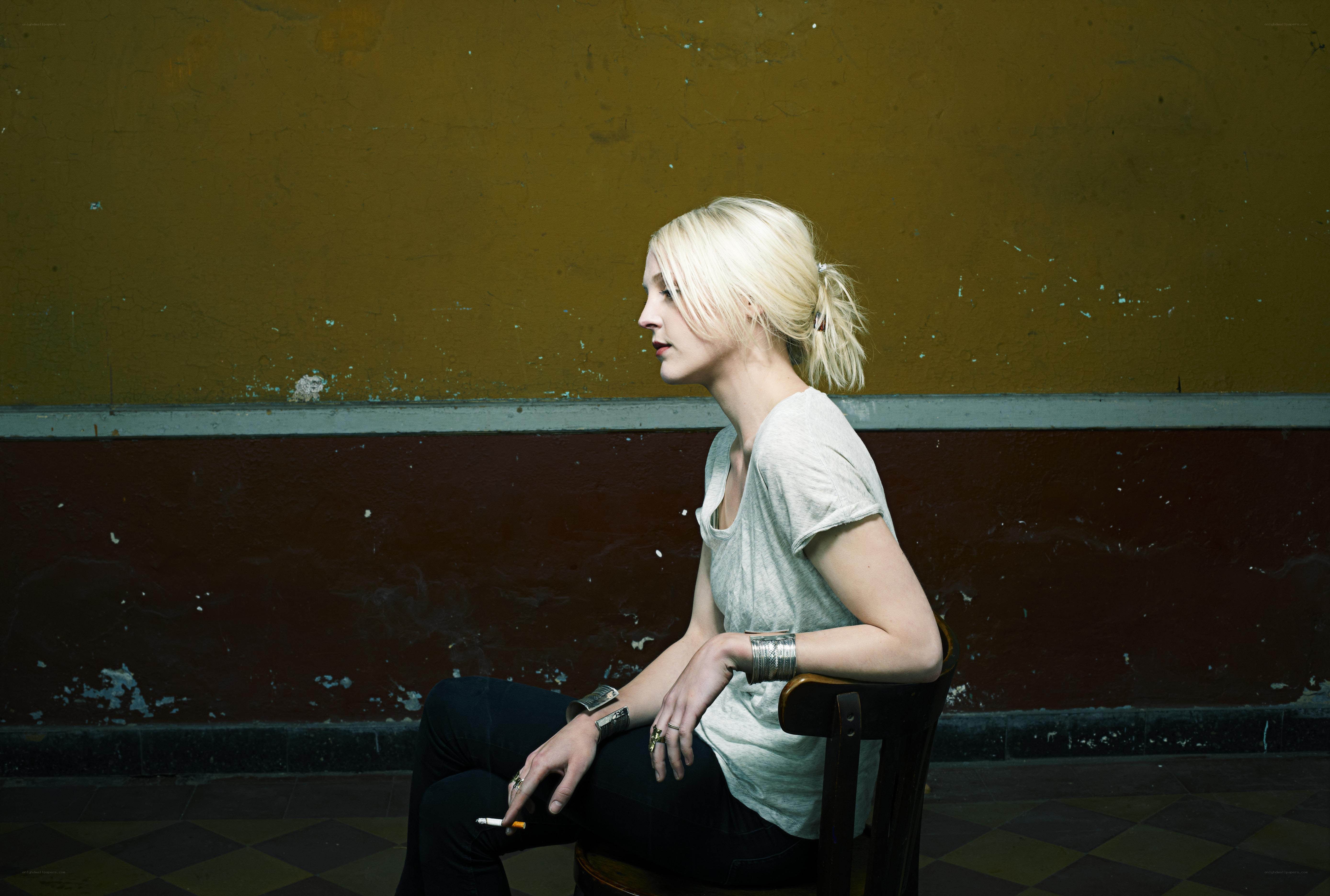 woman sitting with cigarette