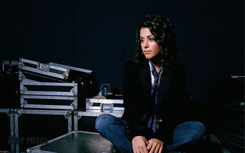 woman sitting with equipment cases