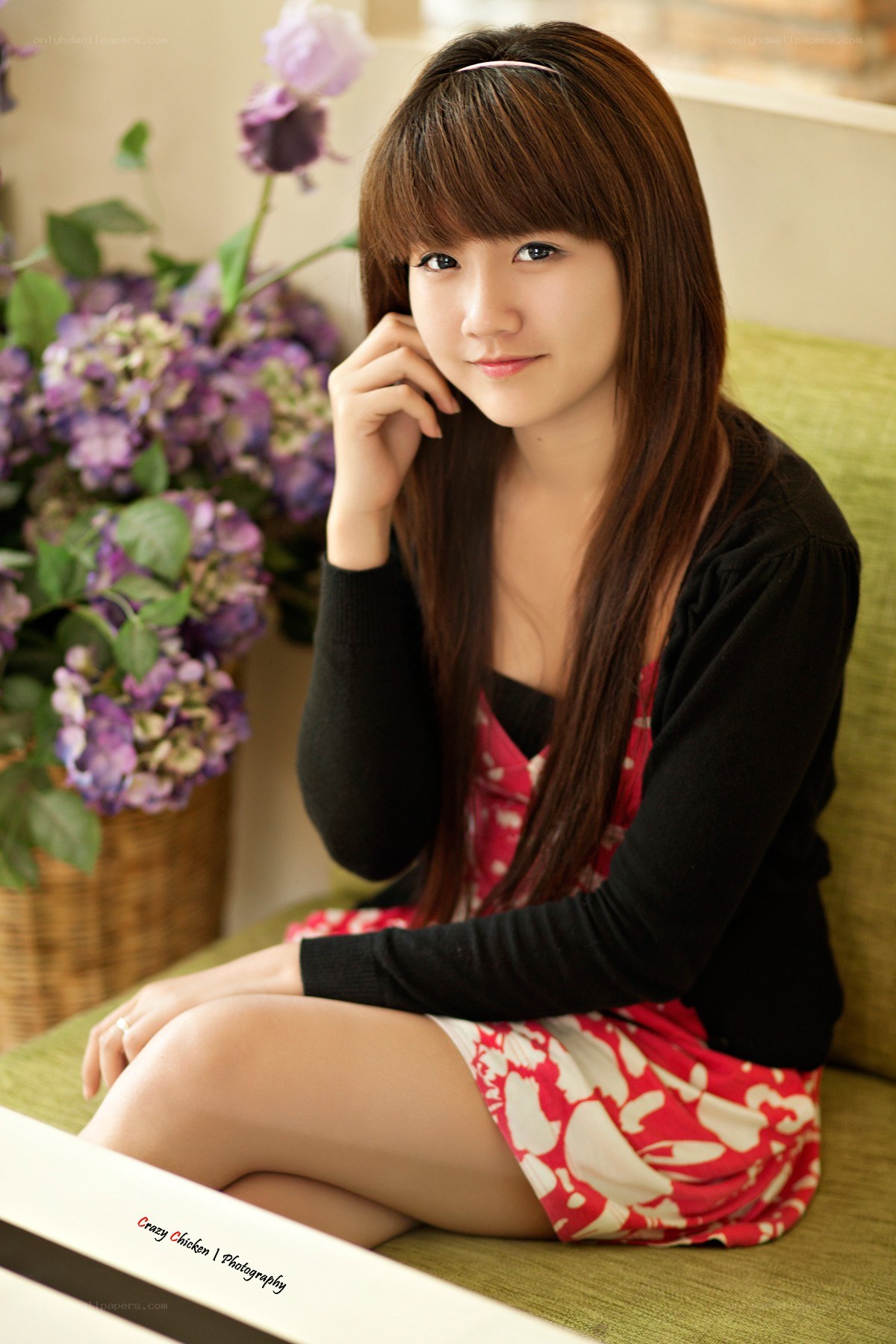 woman sitting with flowers