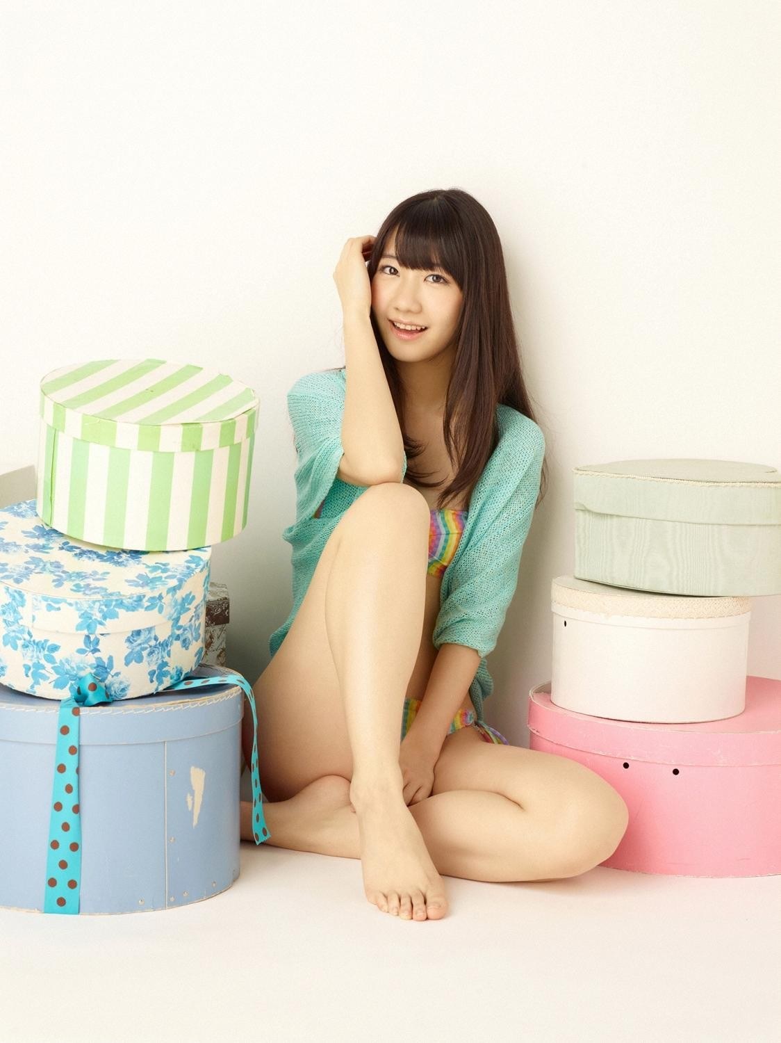 woman sitting with gift boxes