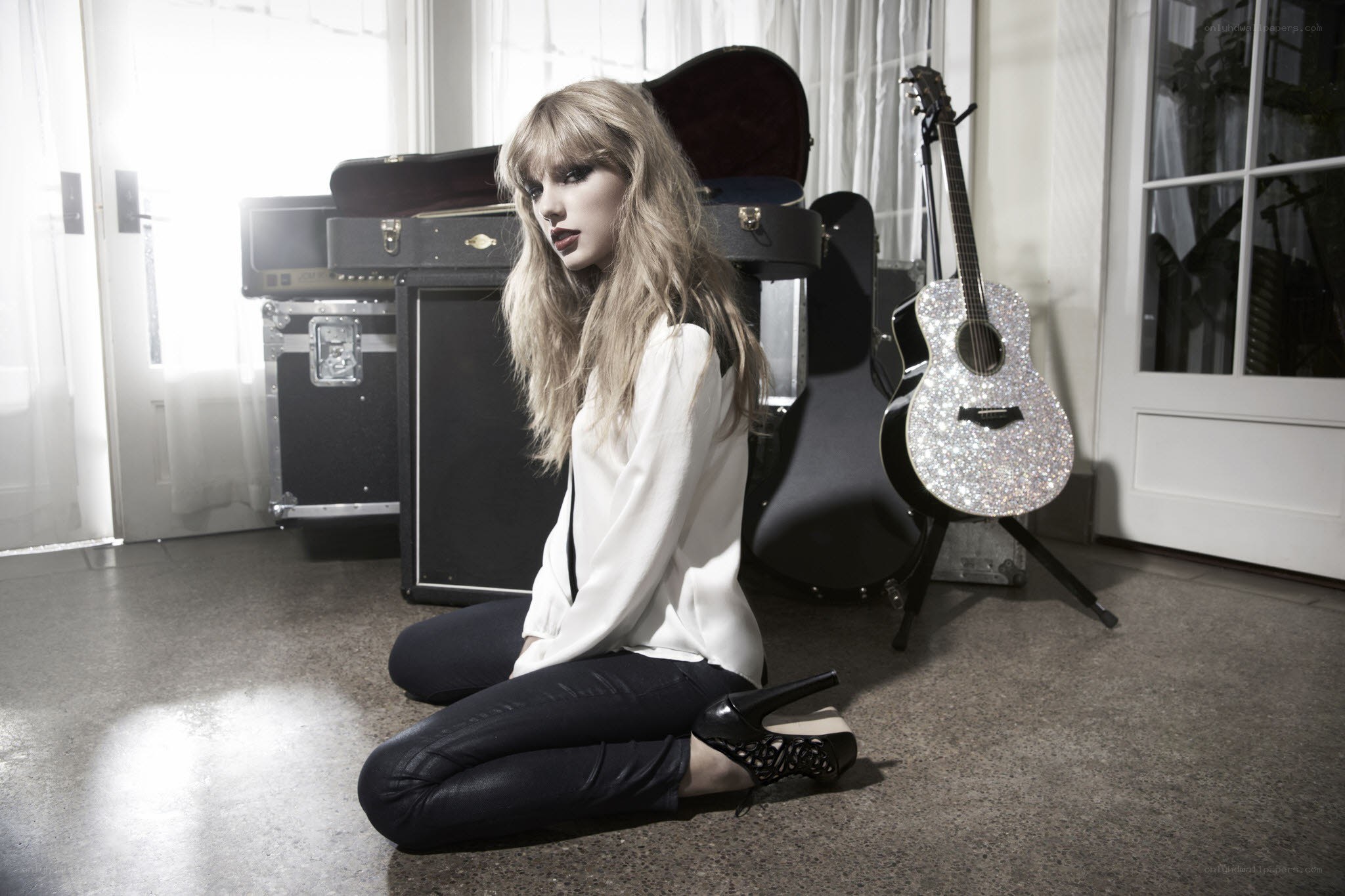 woman sitting with guitar
