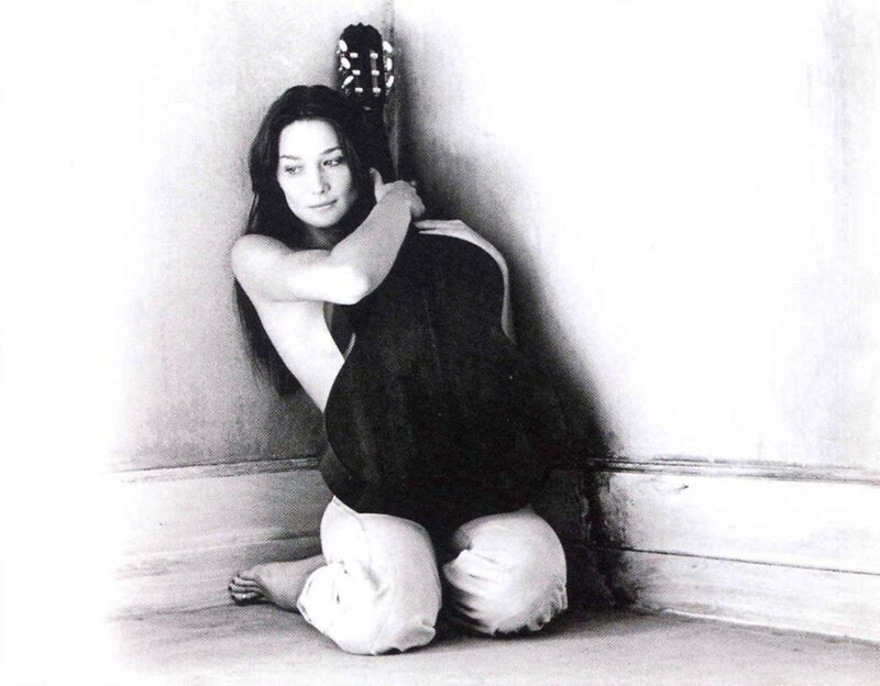 woman sitting with guitar