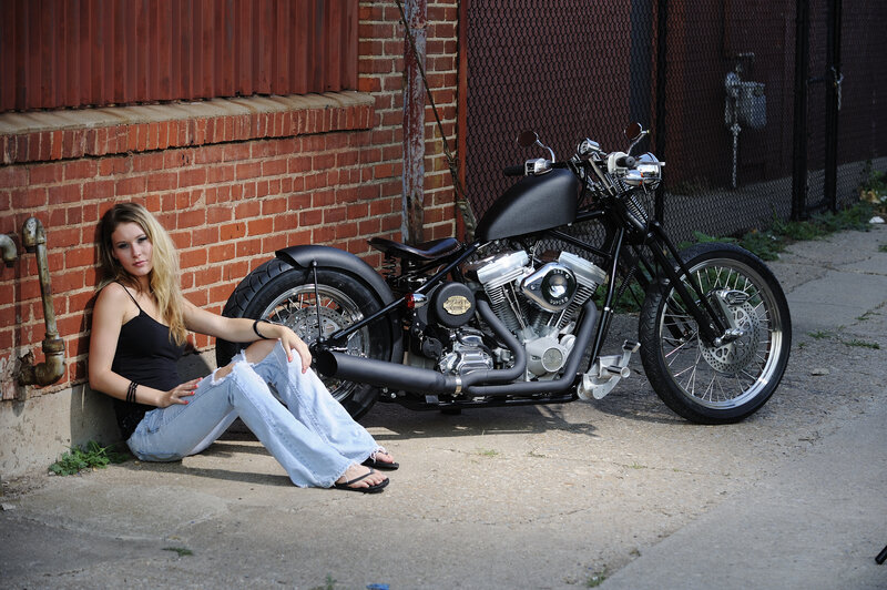 Woman Sitting with Motorcycle — Black, Calm