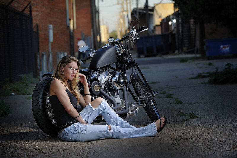 Woman Sitting with Motorcycle — Black