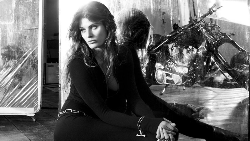 woman sitting with motorcycle
