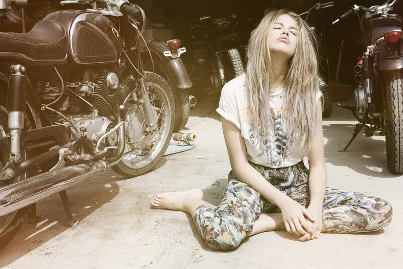 woman sitting with motorcycles