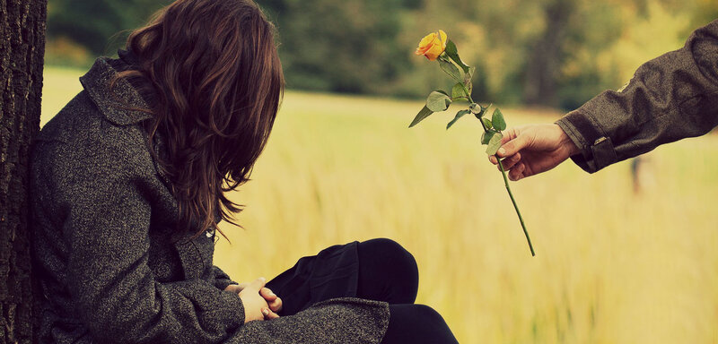 Woman Sitting with Rose