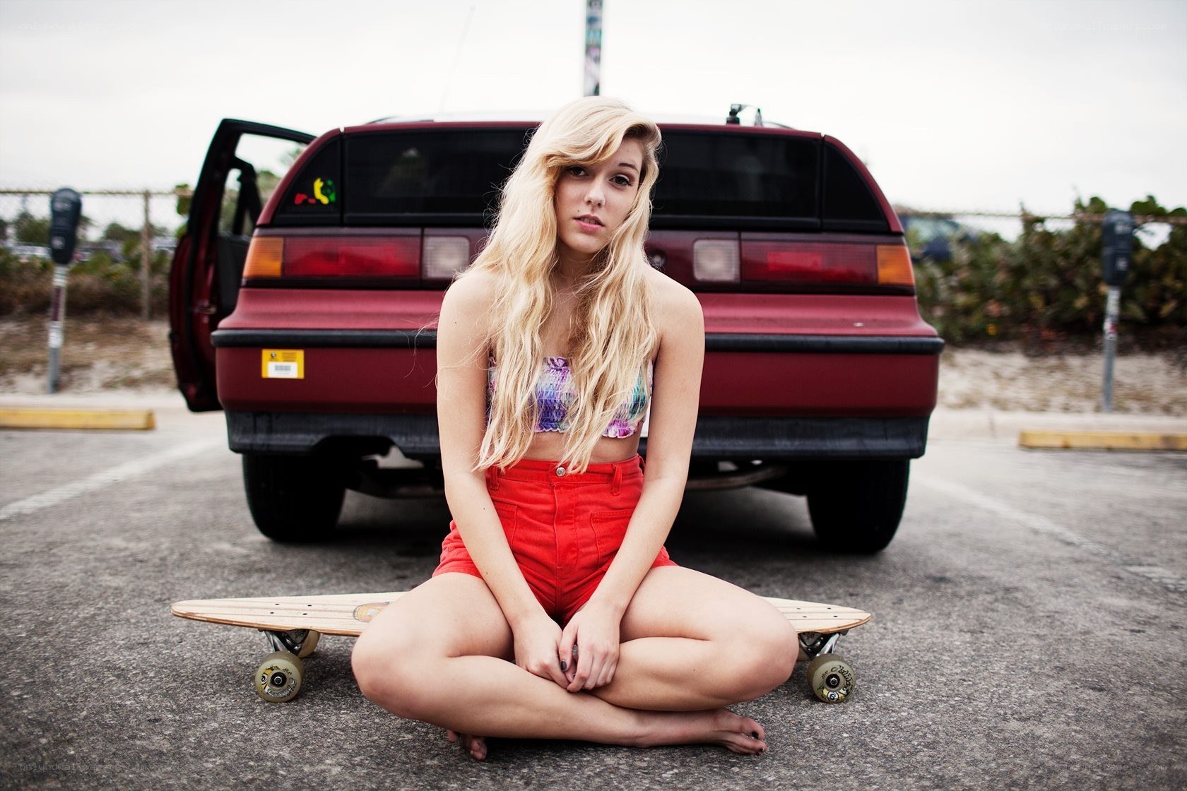 woman sitting with skateboard