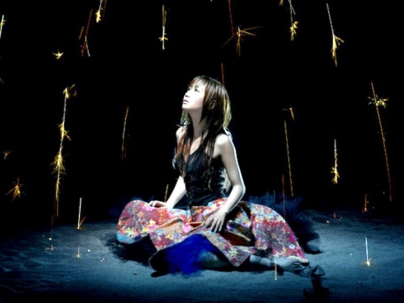 woman sitting with sparklers