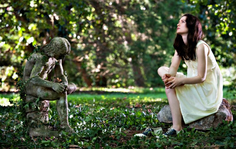 Woman Sitting with Statue — Green, Serene