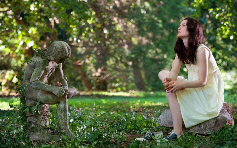 Woman Sitting with Statue — Green