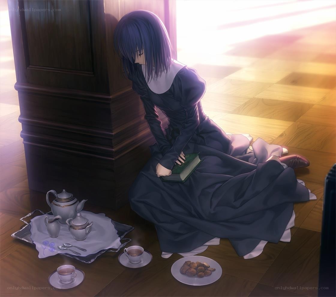 woman sitting with tea set