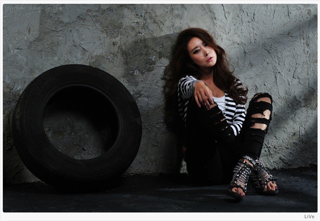 woman sitting with tire