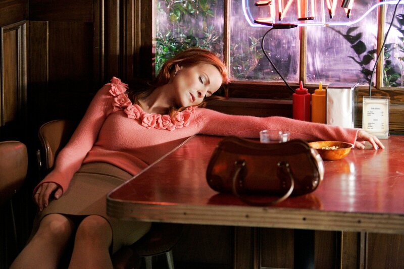 Woman sleeping at diner table