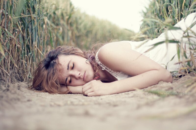 woman sleeping in a field