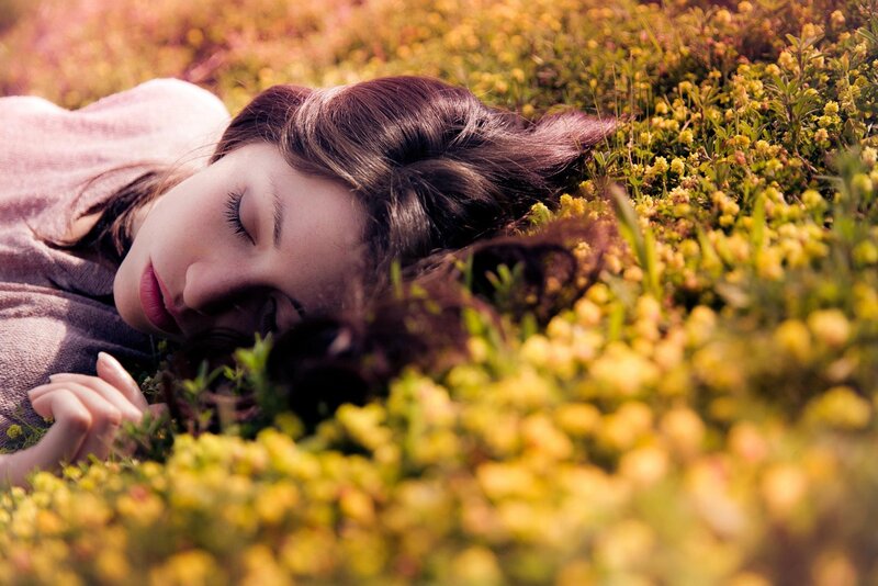 woman sleeping in a field