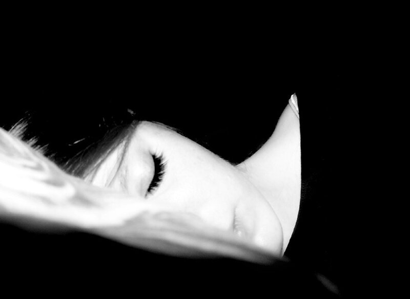 woman sleeping in black and white