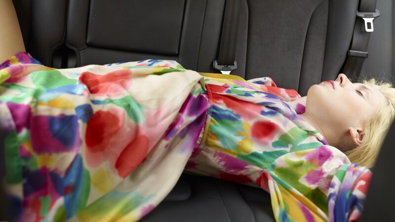Woman sleeping in car