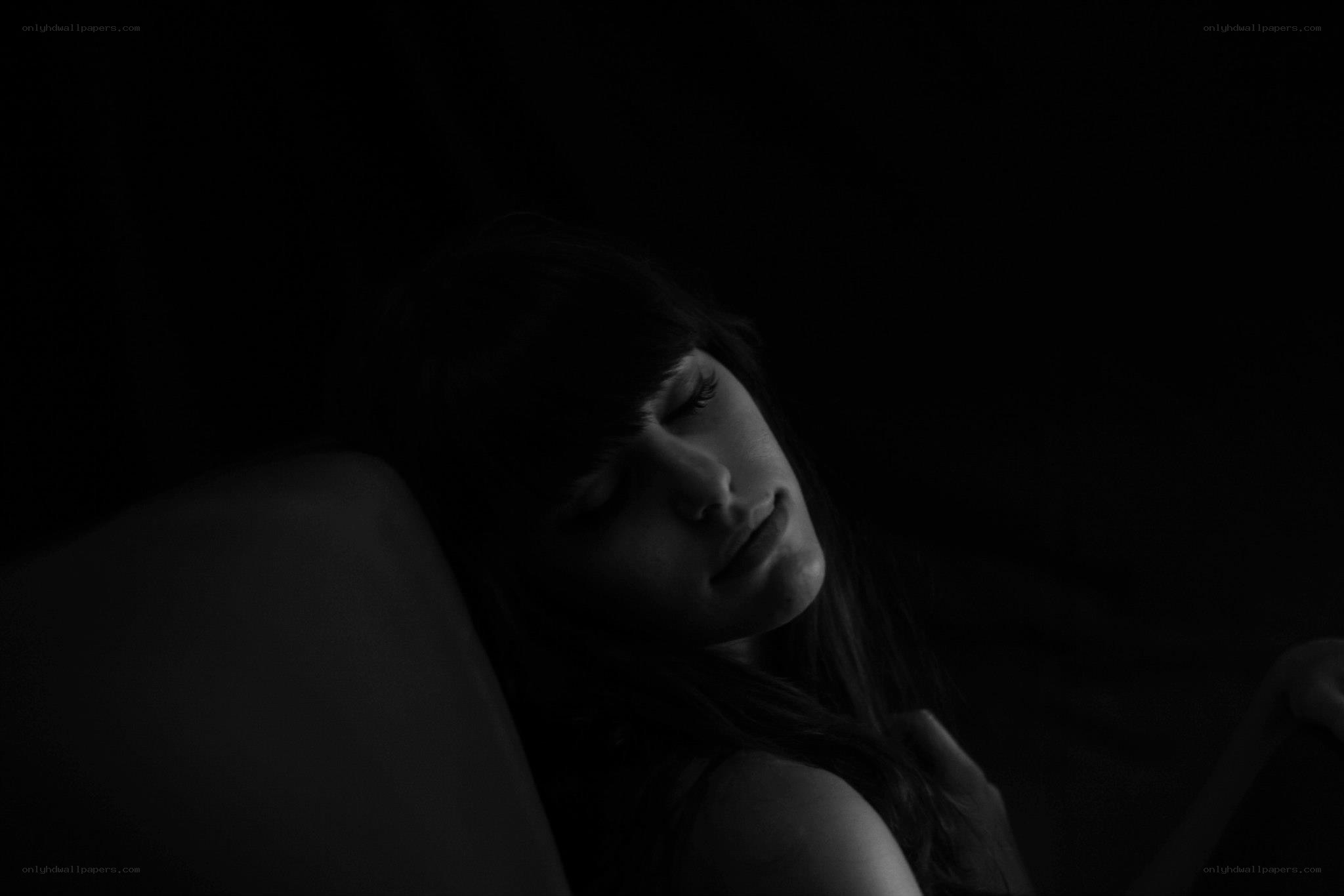 woman sleeping in darkness