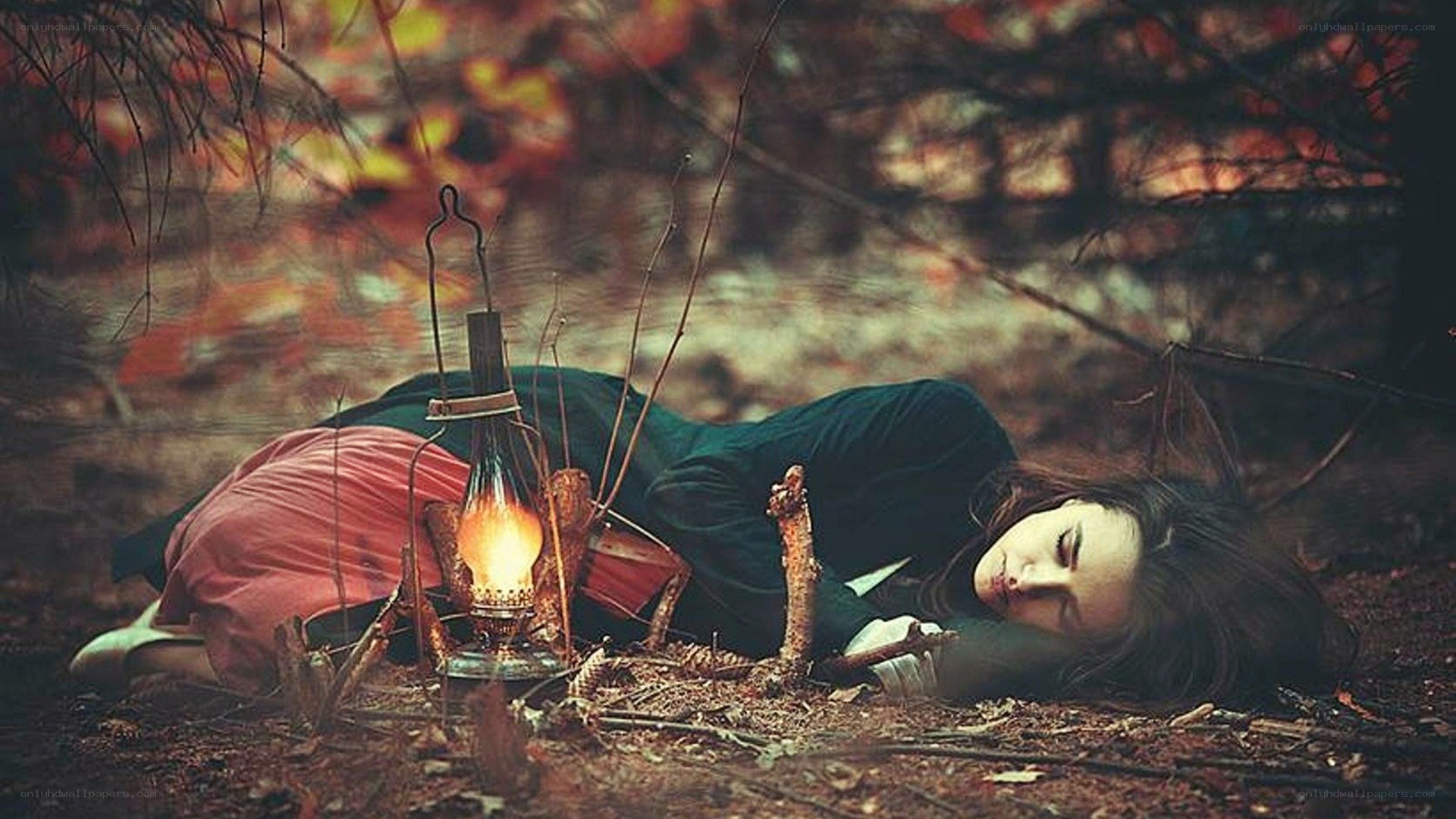 Woman sleeping in forest