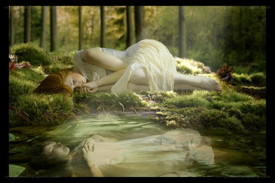 Woman sleeping in forest