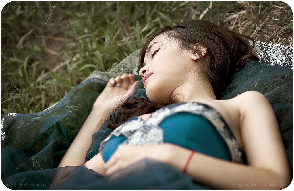 woman sleeping in grass